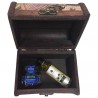 Little chest of dark wood decorated with map with little bottle of olive oil and the marmalade of blueberry