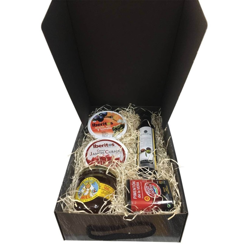 Small gift box with oil, cured ham, honey, paprika and tin oil, garlic and tomato for Christmas