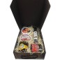 Small gift box with oil, cured ham, honey, paprika and tin oil, garlic and tomato for Christmas