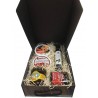 Small gift box with oil, cured ham, honey, paprika and tin oil, garlic and tomato for Christmas
