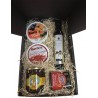 Small gift box with oil, cured ham, honey, paprika and tin oil, garlic and tomato for Christmas