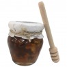 Emballez le pot de miel avec des noix et un bâtonnet