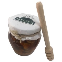 Honey jar with walnuts and tasting stick for events and celebrations