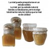 Pack jar of honey with nuts and stick taster