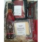 Gift basket with non-alcoholic acorn liqueur and Iberian cured meats.